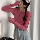 Camisa de manga larga fina acanalada con un diseño suave en azul y rosa